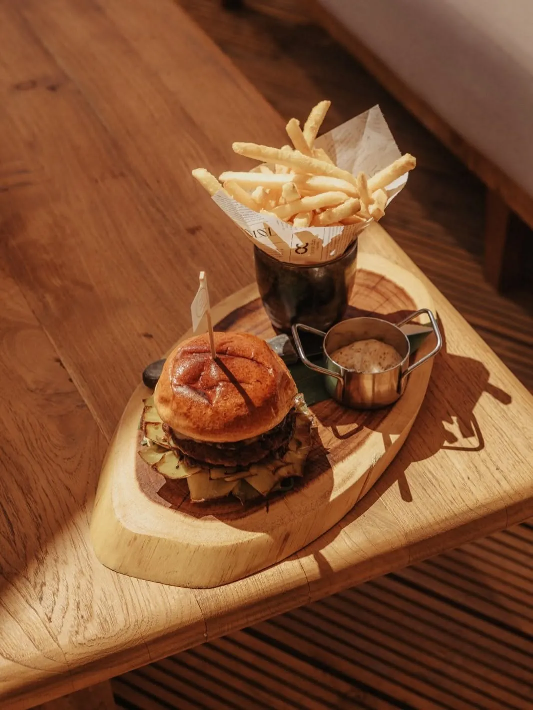 The Dune burger with fries on a wooden board