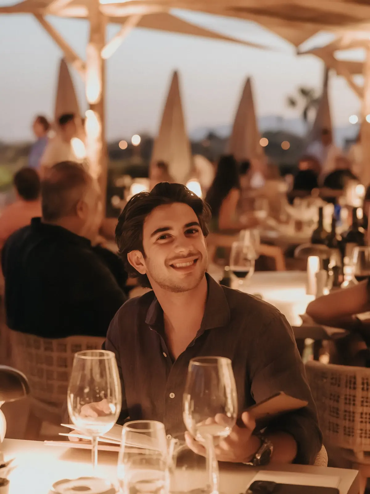 A guest at the table at dusk